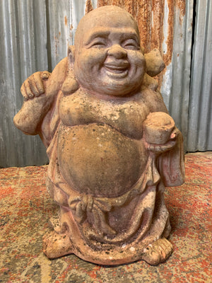 A large terracotta buddha statue