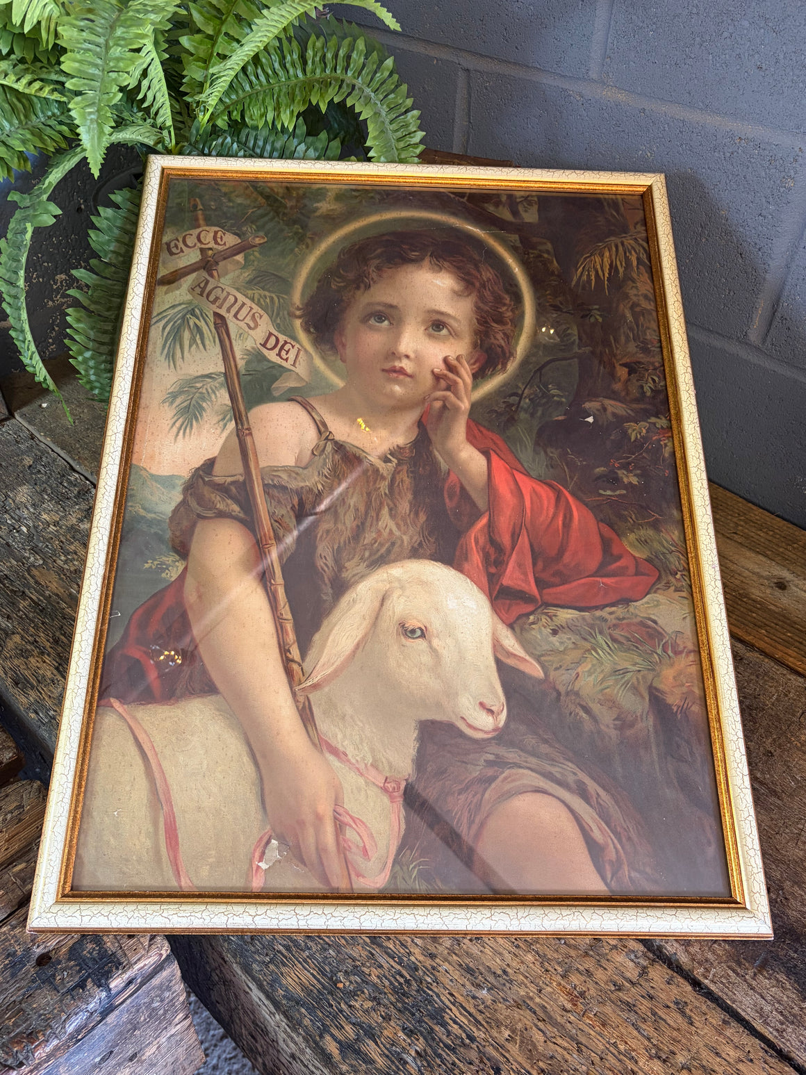 A framed Ecce Agnus Dei print