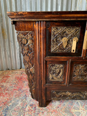 A carved wooden Chinese altar cabinet