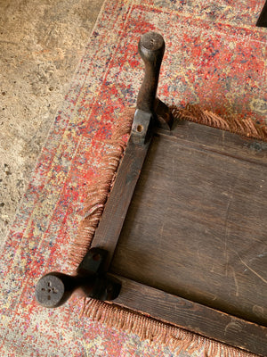 A large Persian carpet footstool