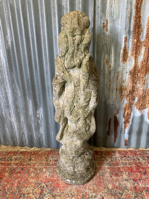 A cast stone garden statue of Guanyin