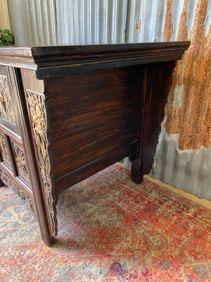 A carved wooden Chinese altar cabinet