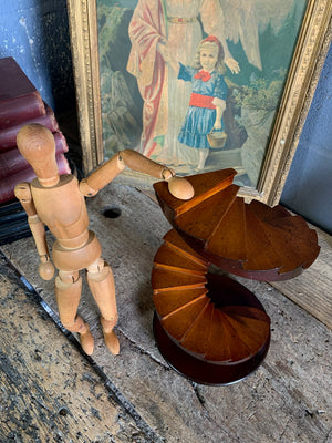 A wooden spiral staircase model