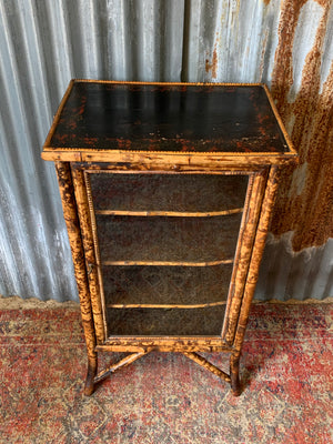 A tiger bamboo display cabinet