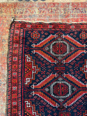 A Persian red & blue ground rectangular rug ~ 179cm x 96cm