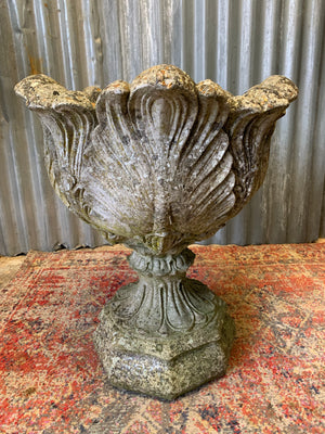 A pair of large acanthus cast stone urns