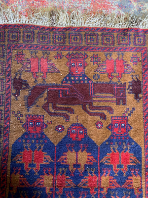 A Persian or Kurdish red ground pictorial rug - 165cm x 92cm