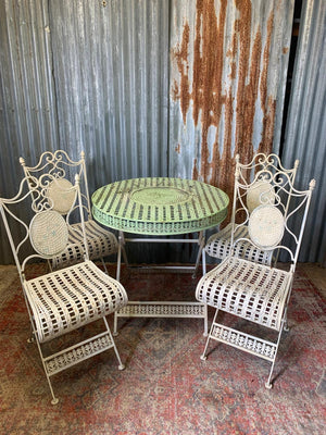 A lattice design garden table and chairs set