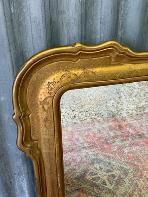 A large giltwood wall mirror