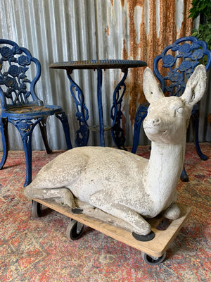 A large deer or fawn garden statue