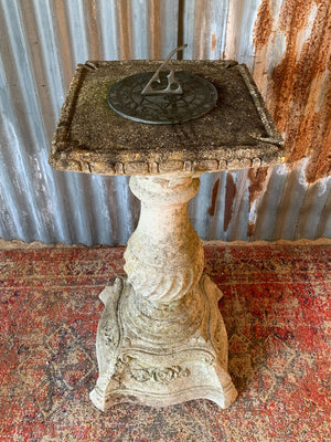 A large cast stone sundial