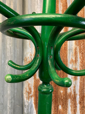 A tall bentwood coat stand with hat rack