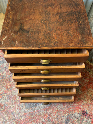 A pine chest of six drawers on castors