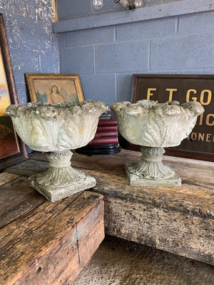 A pair of large acanthus cast stone urns