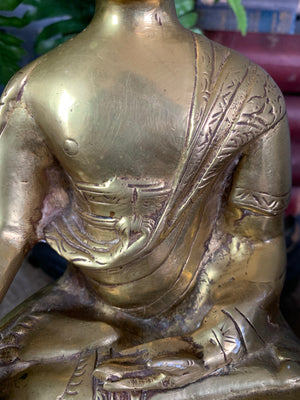 A bronze seated Buddha figure