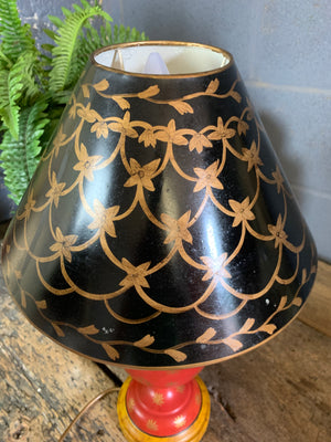 A pair of red and black toleware lamps