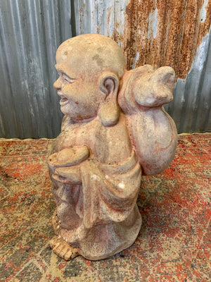 A large terracotta buddha statue