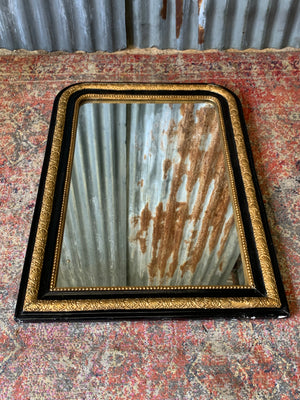 A large French black and gold mirror