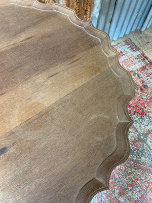 A Georgian style tilt top table with ball and claw feet