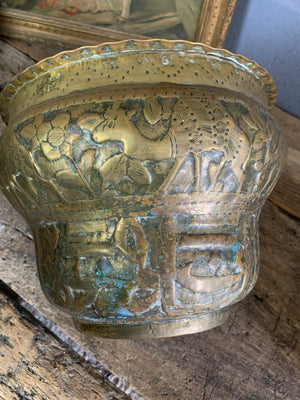 A large Middle Eastern repousse vessel