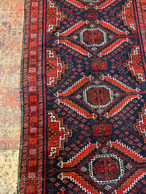 A Persian red & blue ground rectangular rug ~ 179cm x 96cm