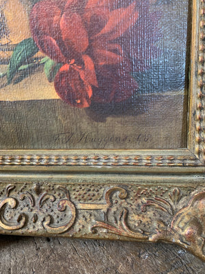 A framed floral oleograph