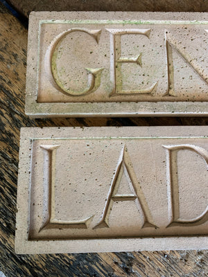 A pair of cast stone plaques ~ "LADIES" & "GENTS"