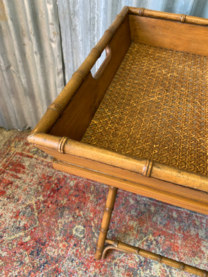 A faux bamboo butler's tray table