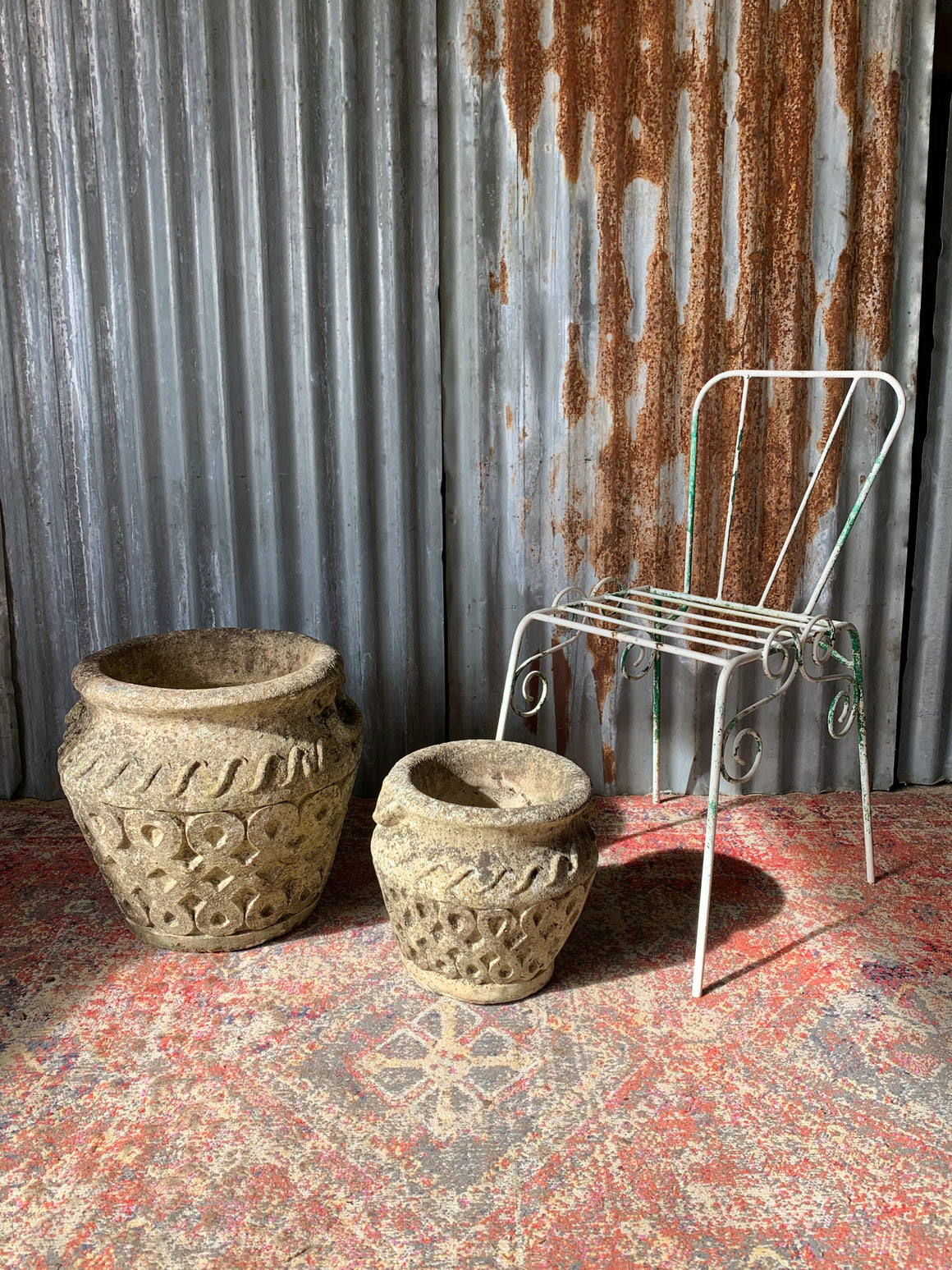 A pair of cast stone Cotswold Studios planters