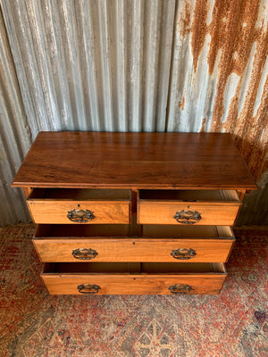 An Art Nouveau chest of drawers
