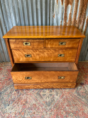 A satinwood chest of drawers