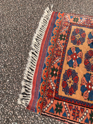 A long yellow ground red blue Persian runner rug ~ 257cm x 67cm