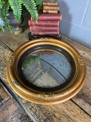 A large Regency giltwood convex mirror