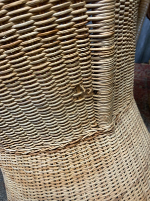 A pair of wicker egg chairs