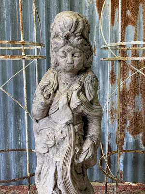 A cast stone garden statue of Guanyin