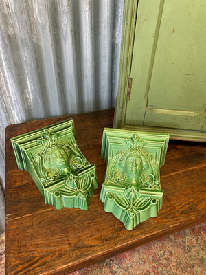 A pair of neoclassical ceramic wall pockets