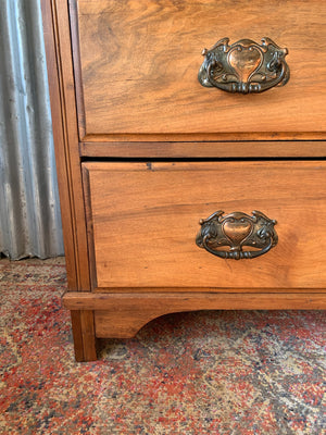 An Art Nouveau chest of drawers