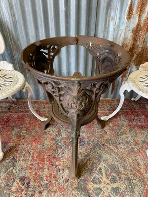 A cast iron Britannia garden table with marble top