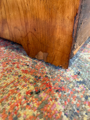 A satinwood chest of drawers