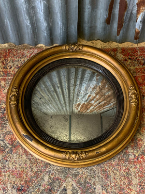 A large Regency giltwood convex mirror