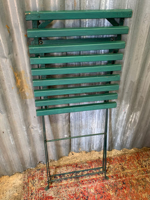 A green garden table and chairs set
