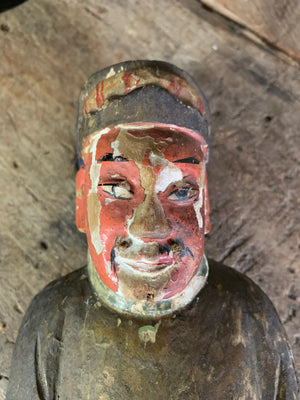 A hand carved Taoist figure