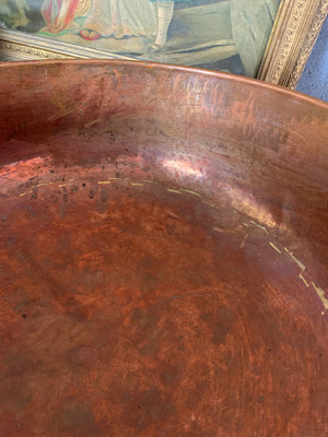A large English beaten copper bowl