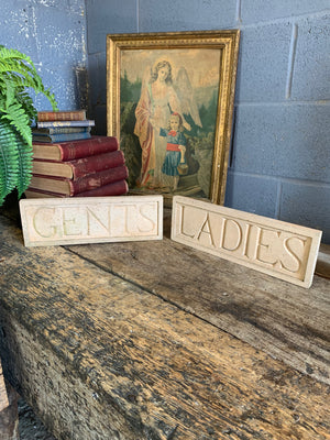 A pair of cast stone plaques ~ "LADIES" & "GENTS"