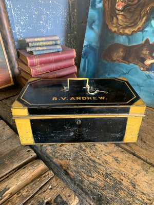 A Victorian black metal strong box with lock and key