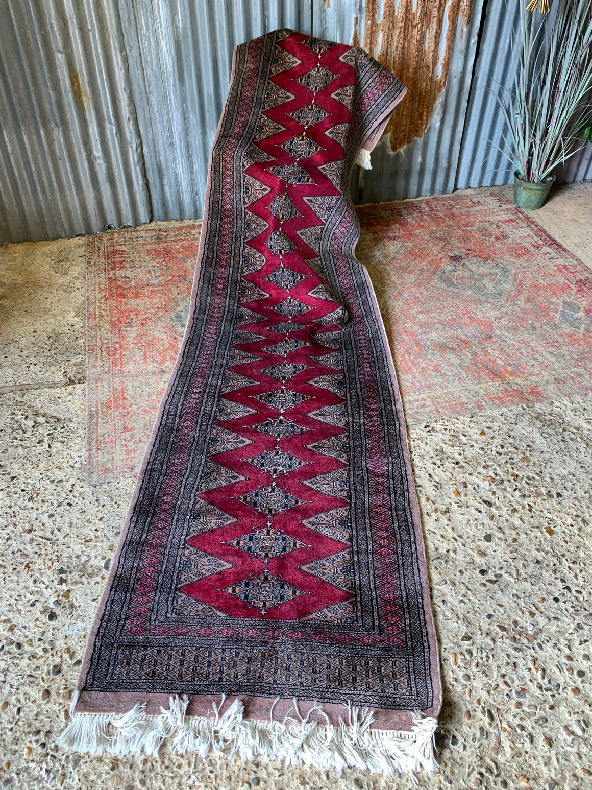 A long pink ground Persian runner rug ~ 318cm x 83cm
