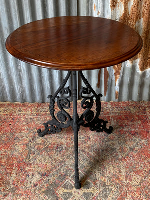 A black cast iron pub table