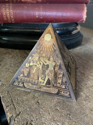 A group of four etched brass Egyptian revival pyramids