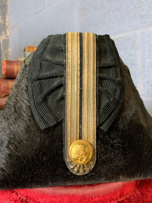 A Royal Navy bicorn hat in monogrammed tin