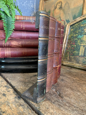 A wood and leather book spine hideaway panel ~A